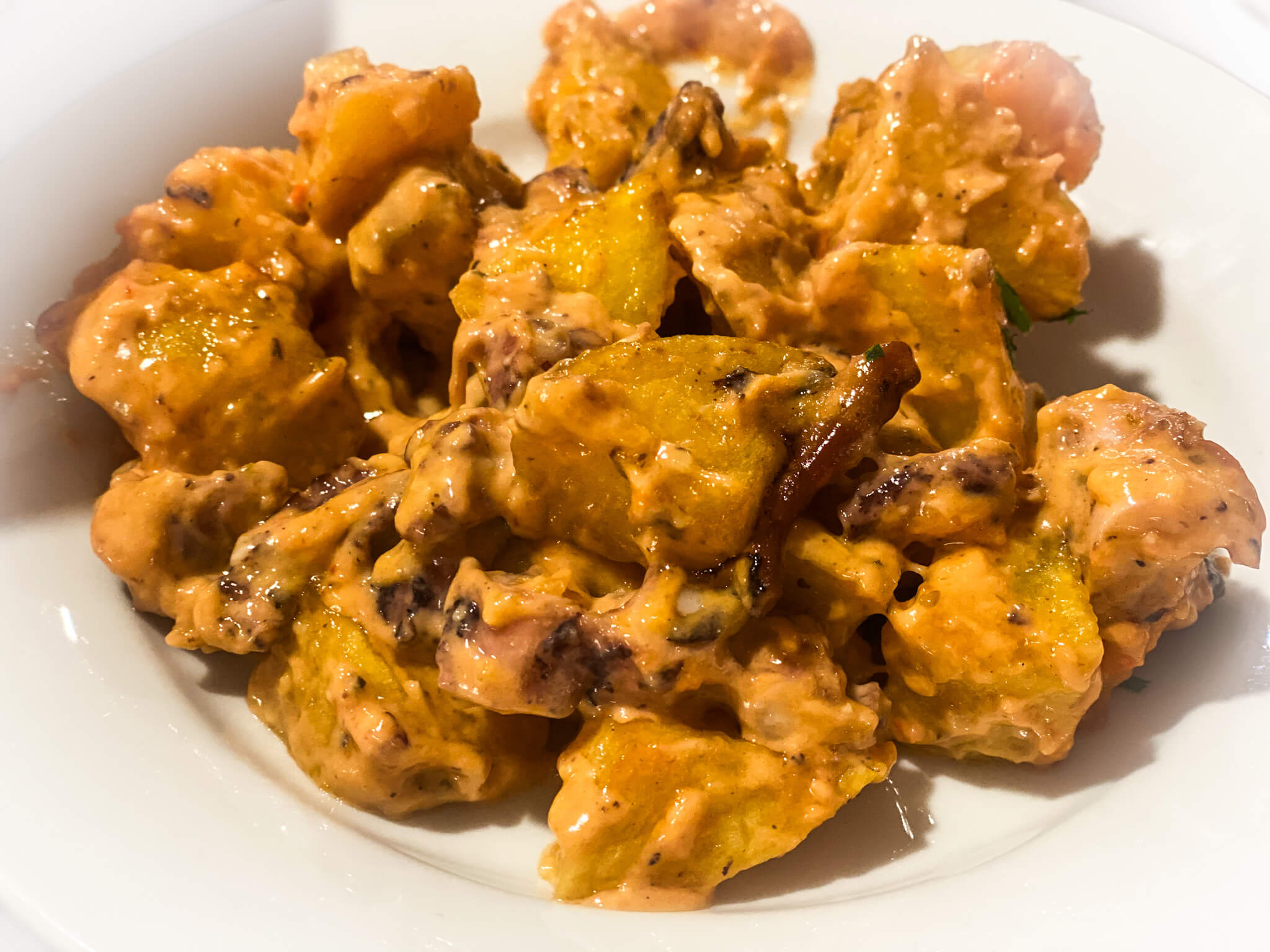 Spanish patatas bravas with octopus