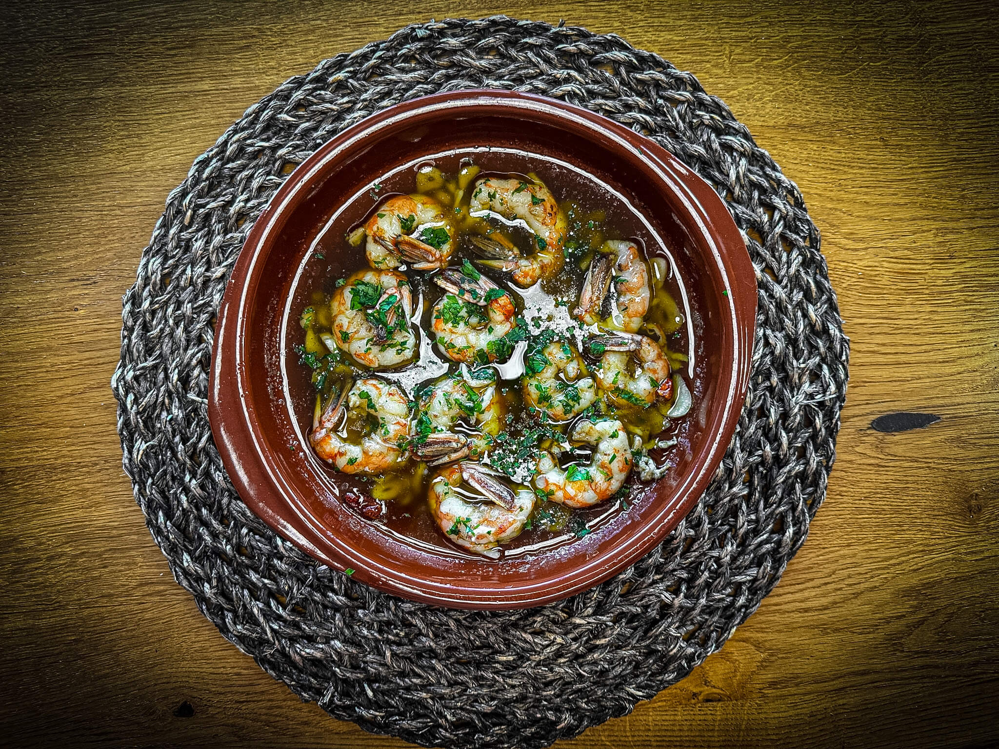Gambas al ajillo clay plate presentation