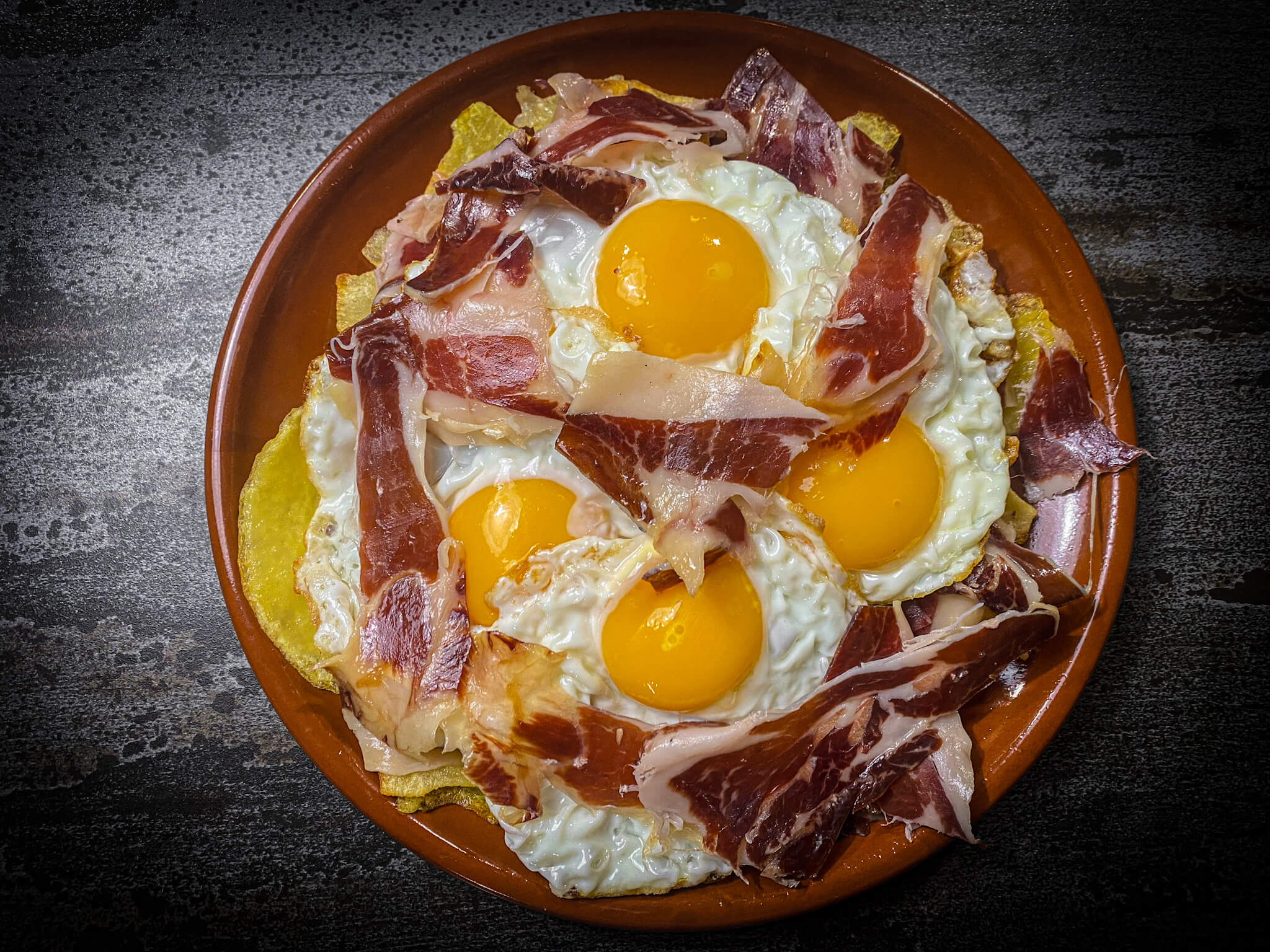 Broken eggs decore iberico ham