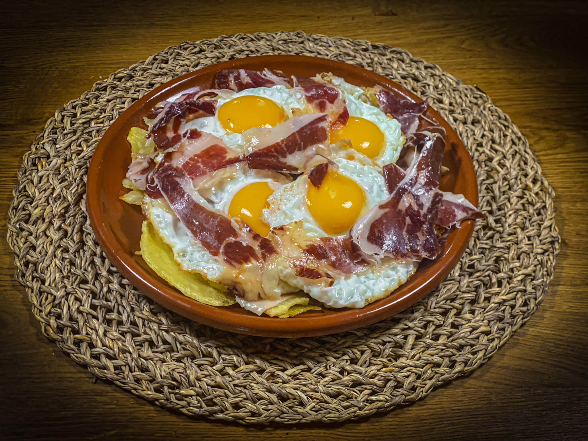 Broken eggs with Iberico Ham