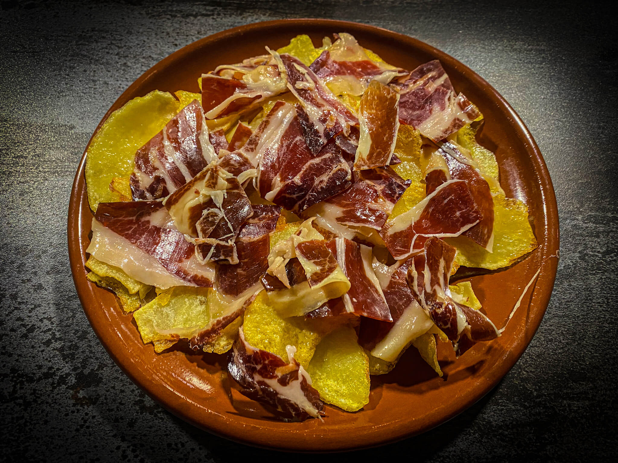 Broken eggs Iberico ham
