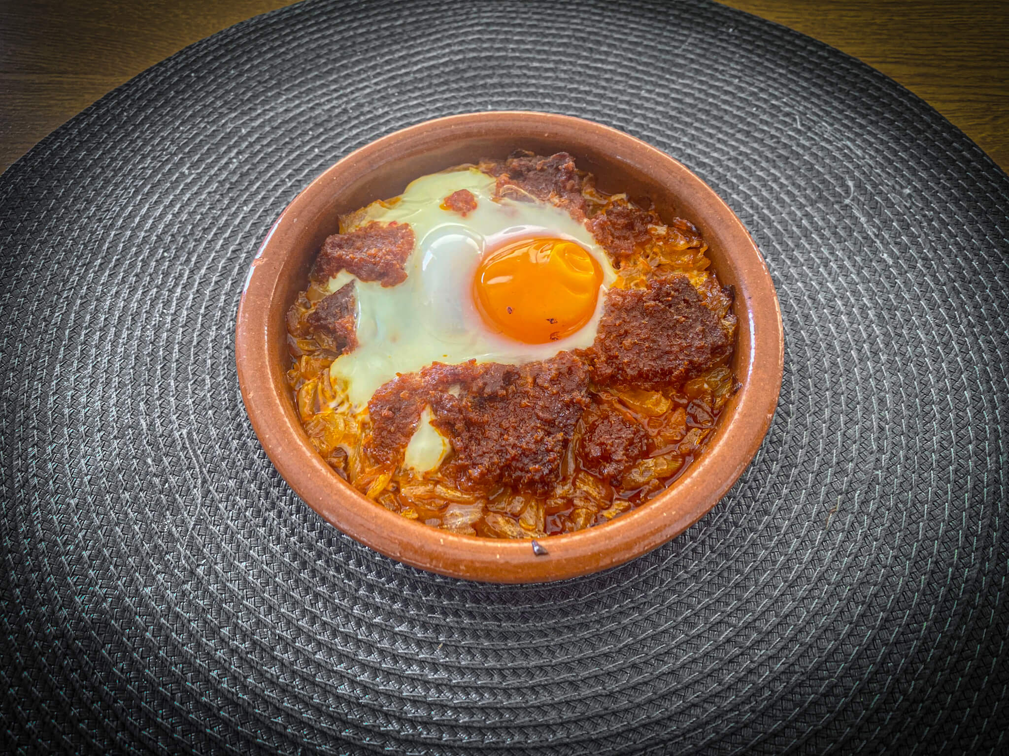 Authentic Mallorcan Eggs with Sobrasada plated panoramic