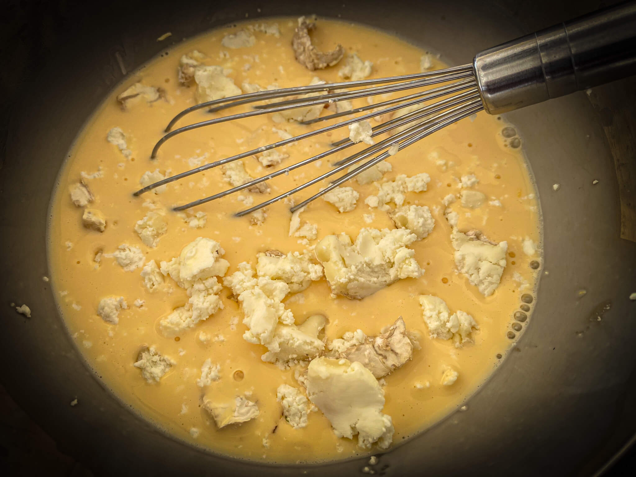Pumpkin and goat cheese mix liquids and cheese