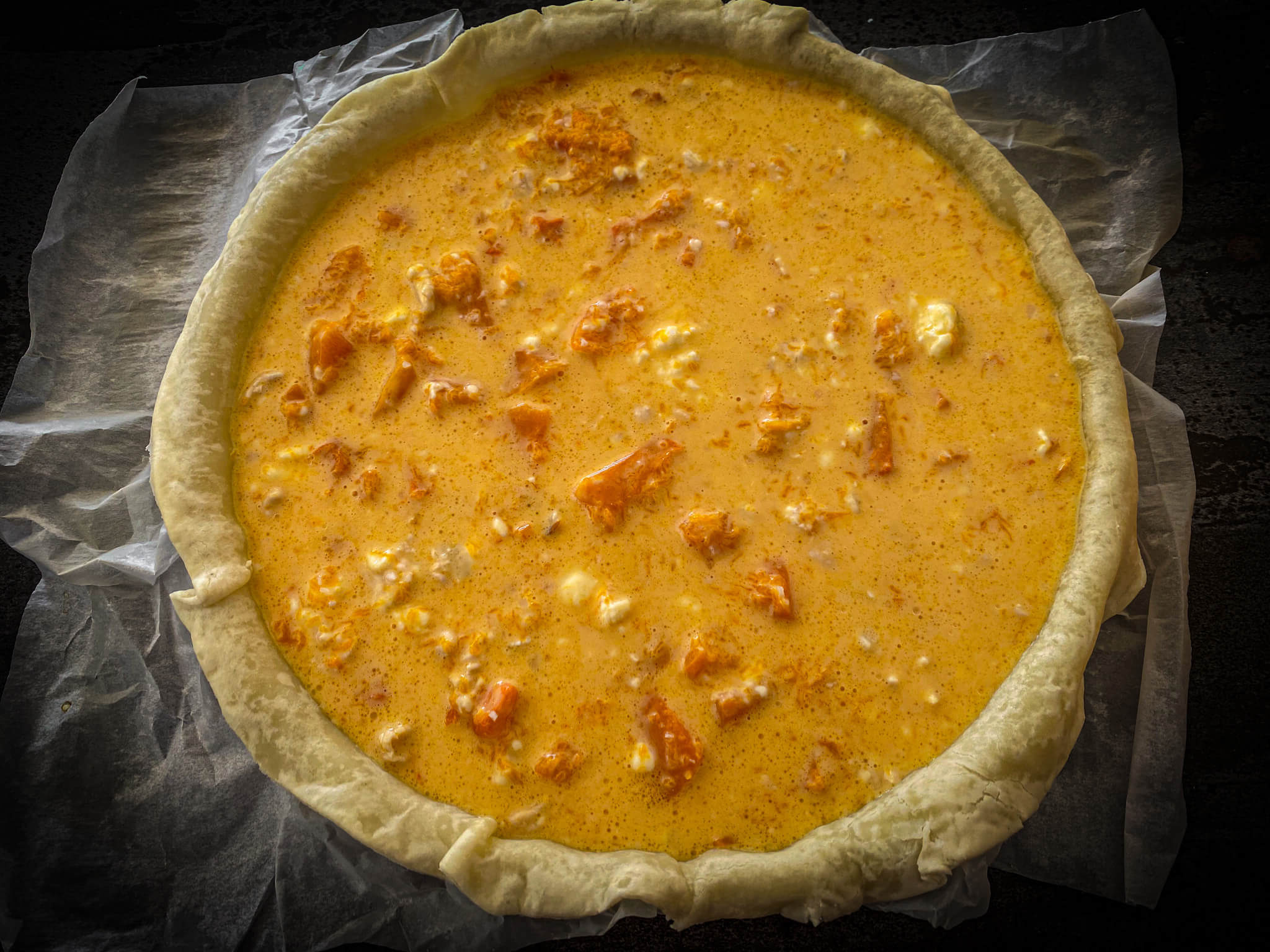 Pumpkin and goat cheese quiche before baking