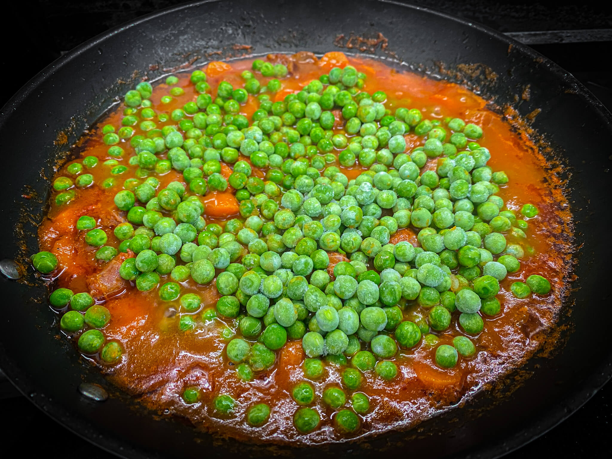 Spanish Chorizo and Vegetablesfried add tomato add carrots add water add peas 1