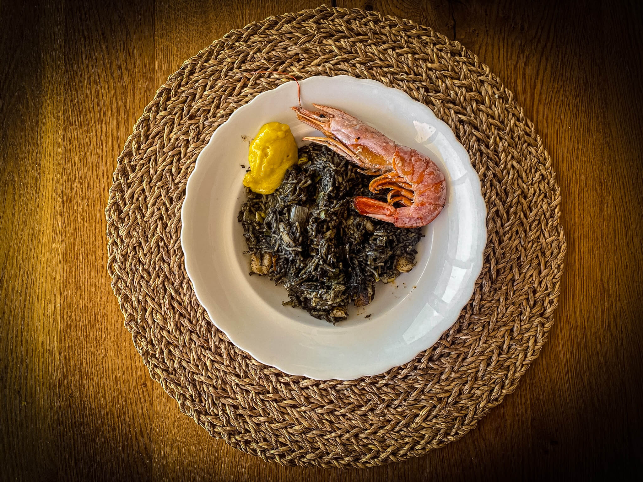 Seafood Black Fideuá with Prawns plated