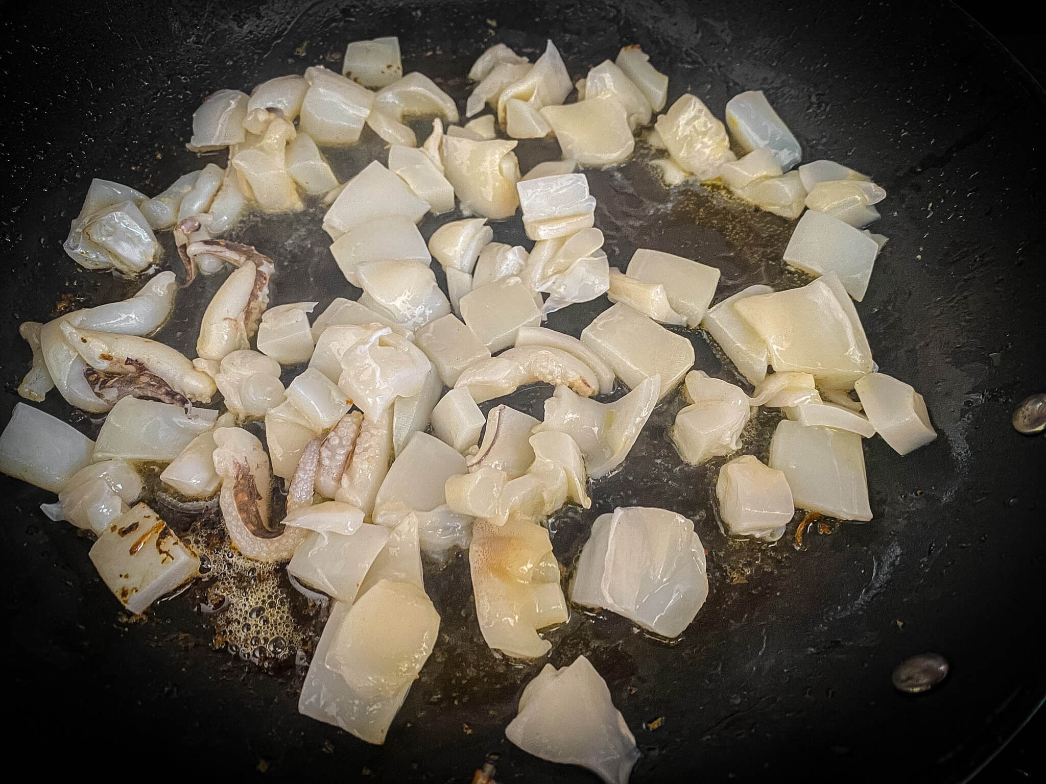 Seafood Black Fideuá with Prawns starting sofrito cuttlefish