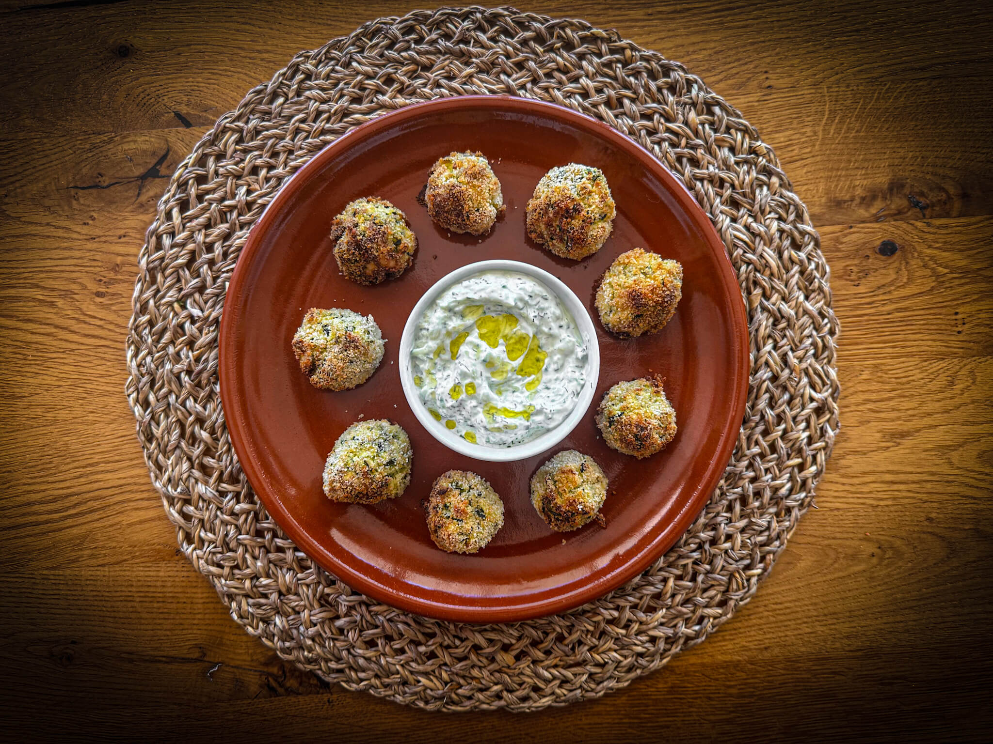Greek zucchini fritters CLAY plated with tzatziki 1