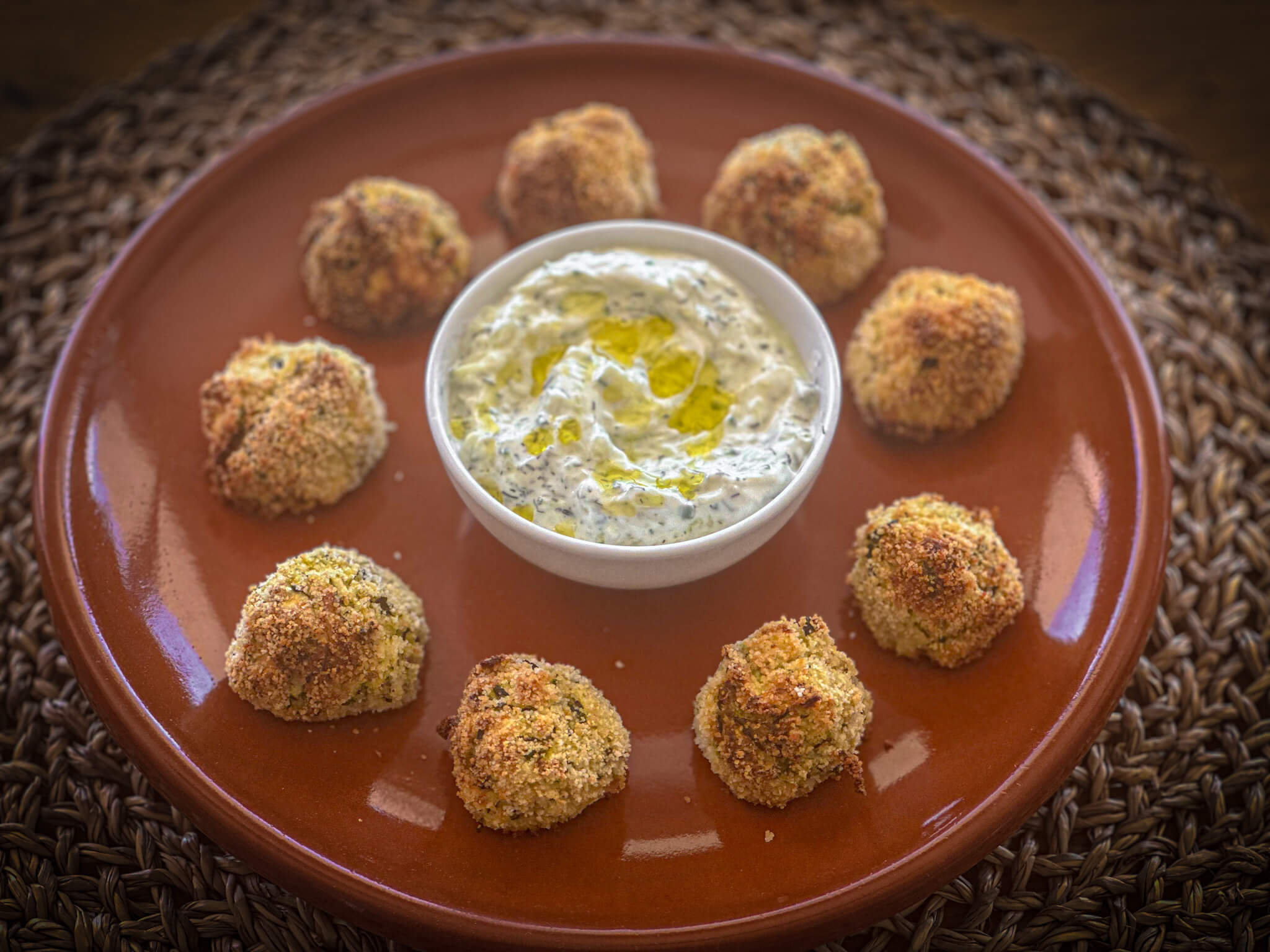 Greek zucchini fritters CLAY plated with tzatziki 2