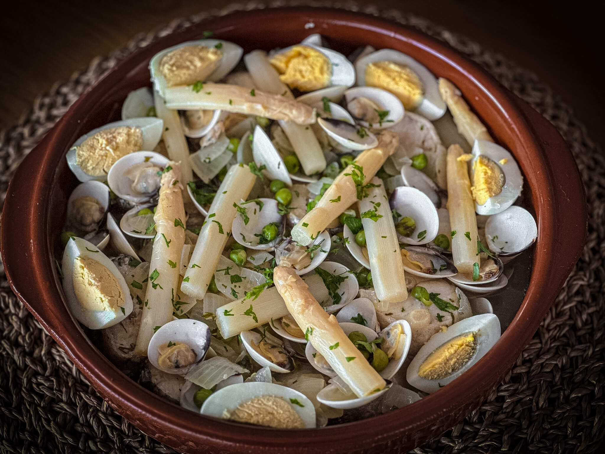 Basque-Style Hake with Clams plated presentation
