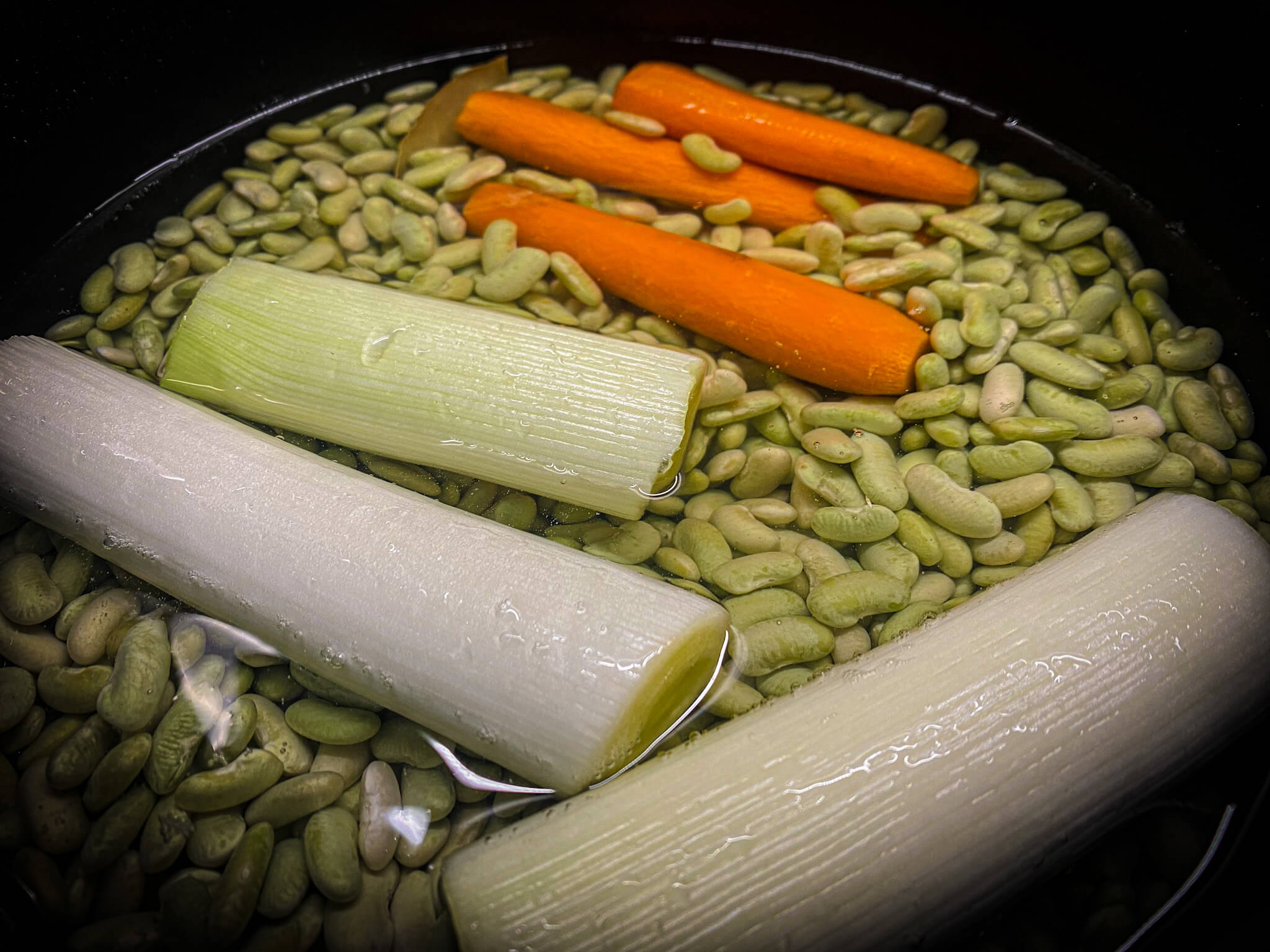 Traditional Asturian Verdinas Beans with Fresh Clams - Adding Water and Green Beans to Pot